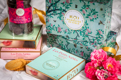 Assorted shortbread biscuits made with pure fresh butter, raspberry and chocolate chips - metal box In a garden